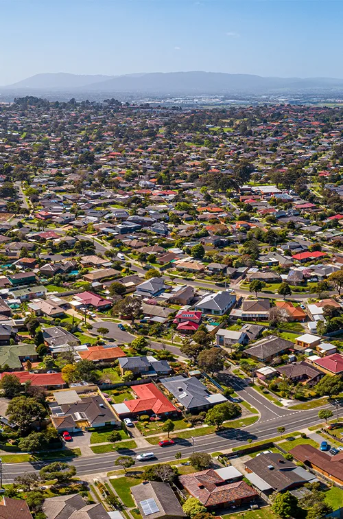 Aerial view of Melbourne suburbs showcasing residential communities, representing A1 Care Group’s wide NDIS service coverage across the region.