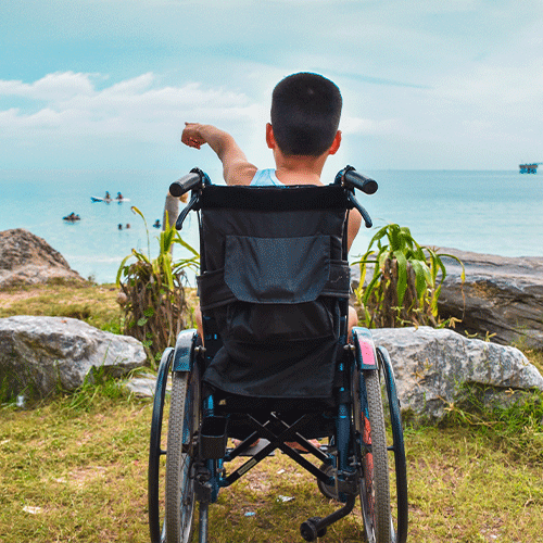 Person using a wheelchair enjoying an outdoor coastal view, representing independence and continence support services in Blacktown, NSW.