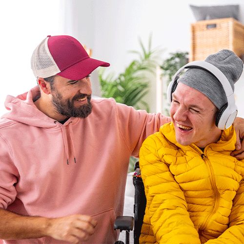 Support worker spending time with a young man in a wheelchair, symbolising friendly continence and disability support in Deer Park, Victoria.