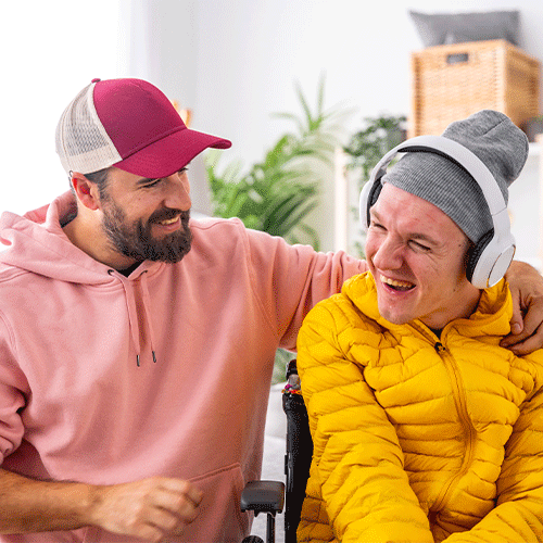 Support worker laughing with a young NDIS participant during a continence assessment in Hurstbridge VIC