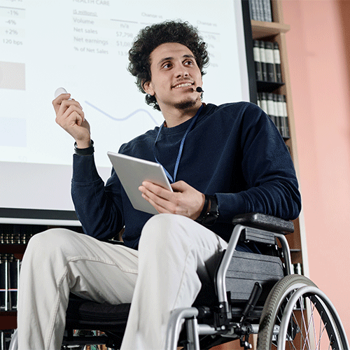 NDIS participant in a wheelchair working from home, reflecting the flexibility of a telehealth continence assessment in Bundoora, VIC