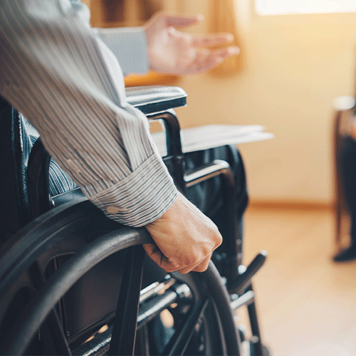 NDIS participant in a wheelchair during an at-home telehealth continence assessment in St Marys, NSW